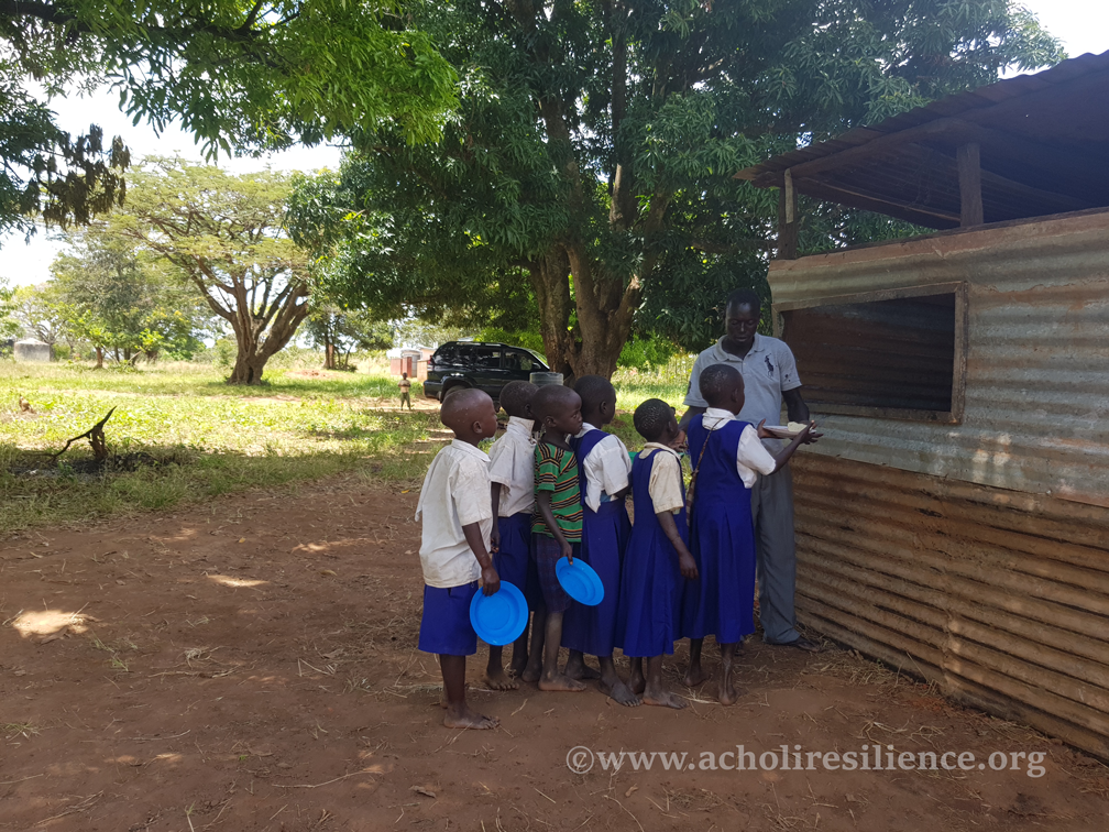Students lining up to receive a hot meal