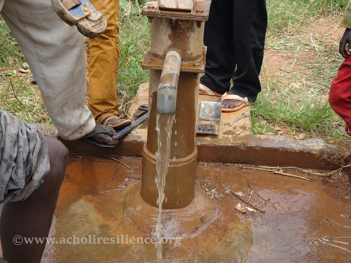Villagers at a newly drilled Acholi Resilience borehole