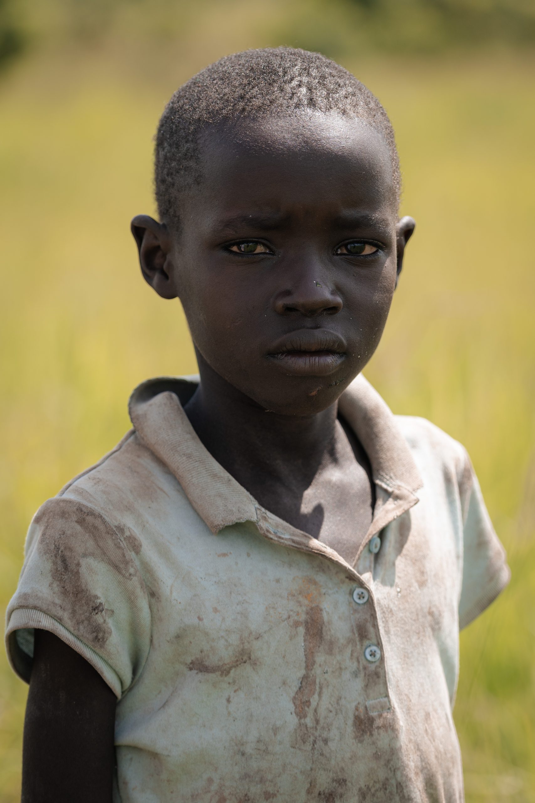Caregiver supporting a child affected by nodding syndrome